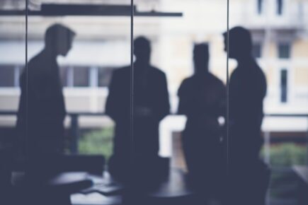 Silhouette business people discussing in meeting room