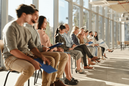 People sat in a hallway