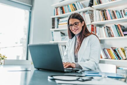 Woman looking at her laptop