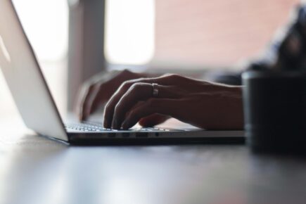 Man typing on a laptop